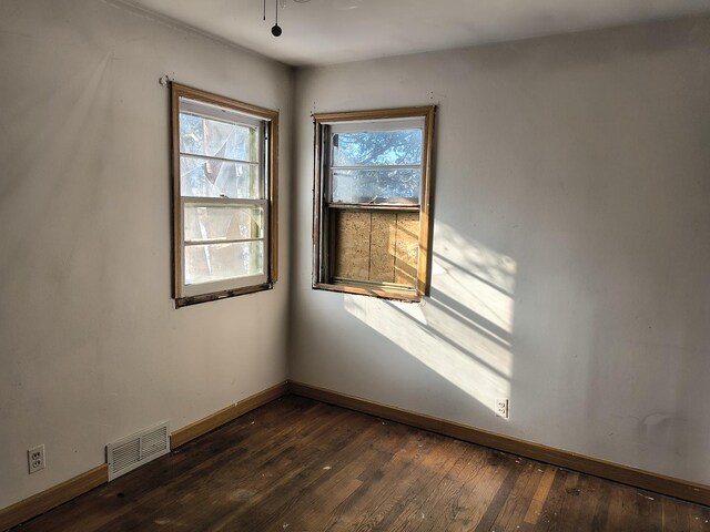 spare room featuring dark hardwood / wood-style floors