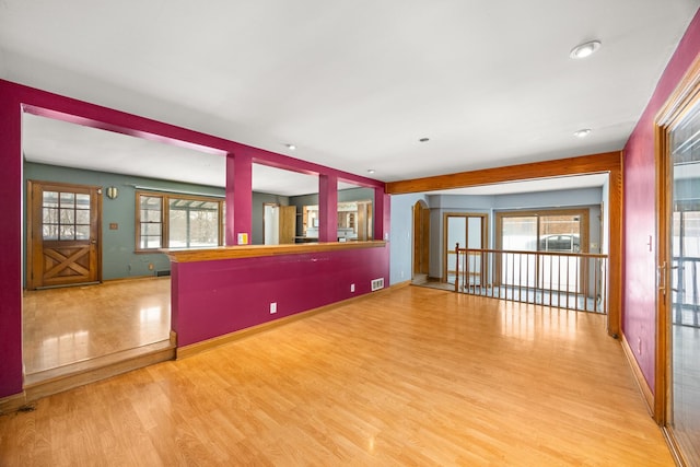 unfurnished living room featuring light hardwood / wood-style flooring