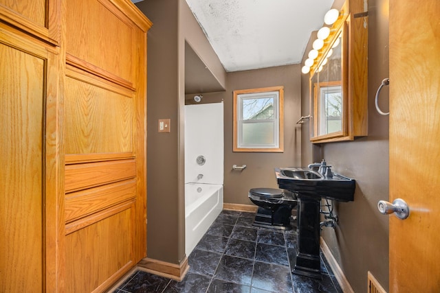 full bathroom featuring shower / washtub combination, toilet, and sink