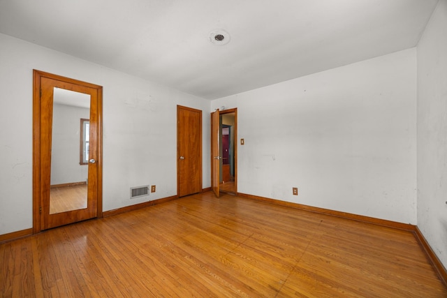 unfurnished room featuring light wood-type flooring