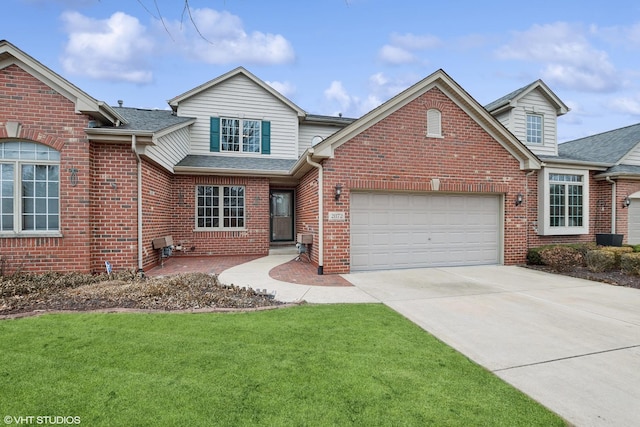 front of property with a garage and a front lawn