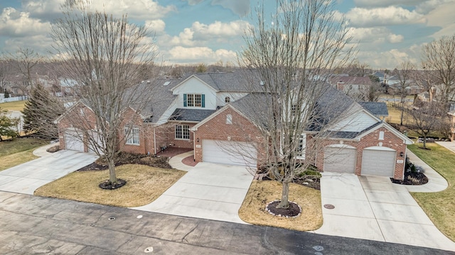 view of front facade featuring a garage and a front lawn