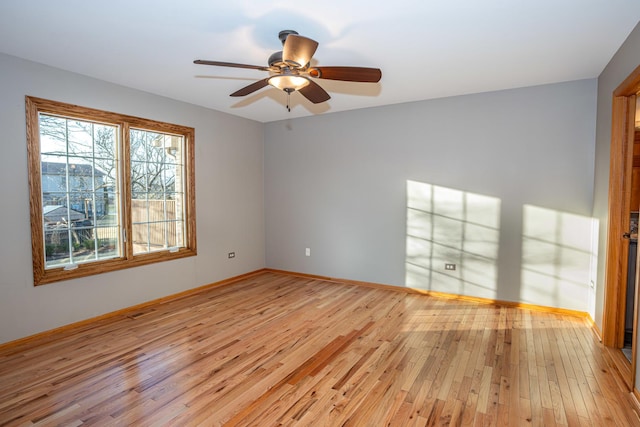 spare room featuring ceiling fan and light hardwood / wood-style floors