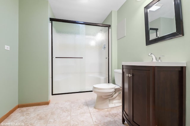 bathroom with tile patterned flooring, vanity, an enclosed shower, and toilet