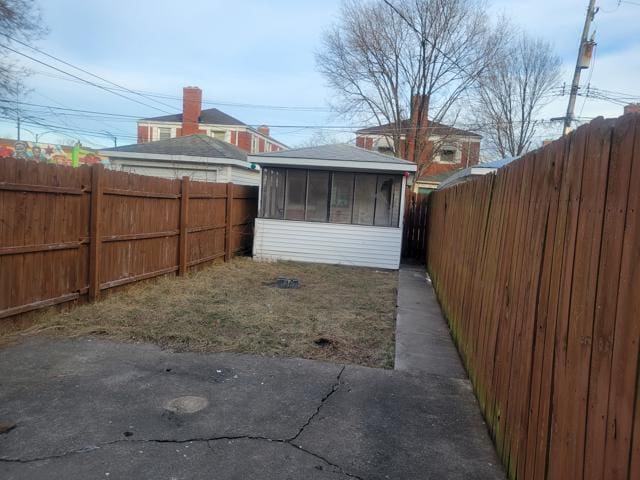 view of yard featuring a sunroom