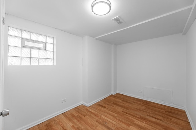 spare room featuring light hardwood / wood-style flooring