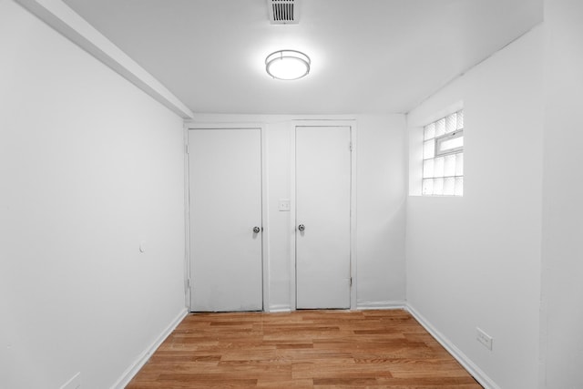 unfurnished bedroom with light wood-type flooring