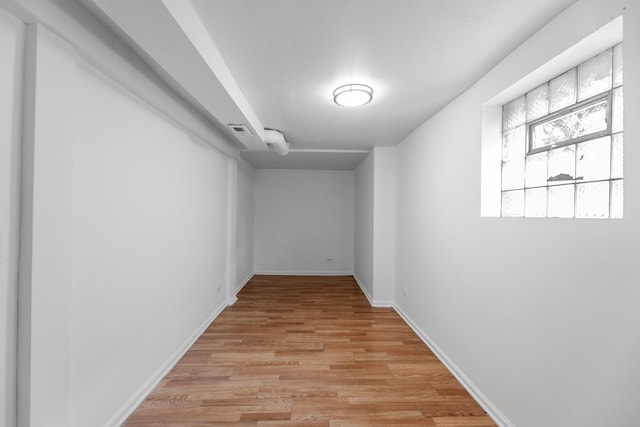 hall with light hardwood / wood-style floors