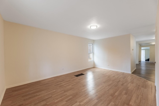 unfurnished room featuring wood-type flooring