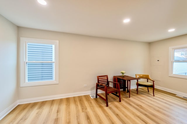 living area featuring light hardwood / wood-style floors