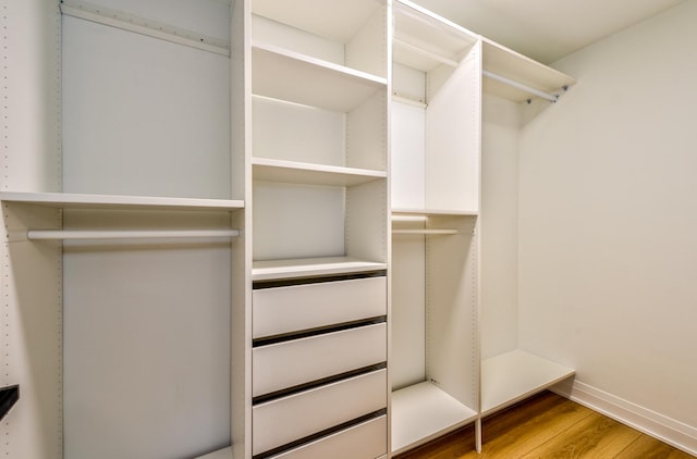 walk in closet featuring hardwood / wood-style floors