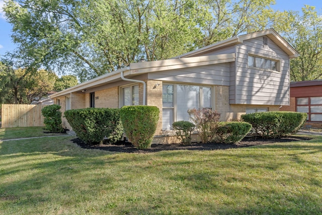 view of property exterior featuring a lawn