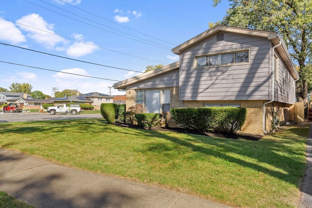 view of home's exterior featuring a lawn