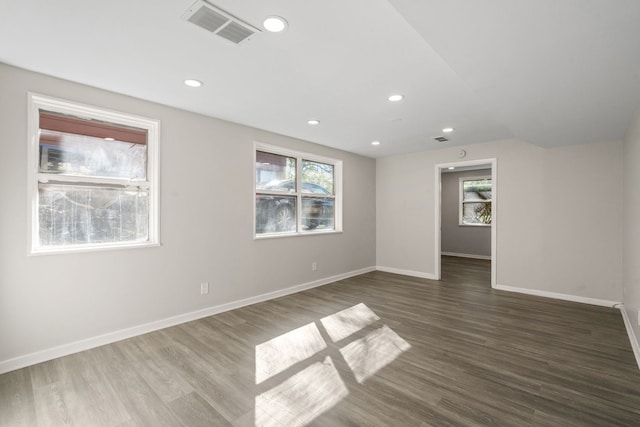 unfurnished room featuring dark hardwood / wood-style floors