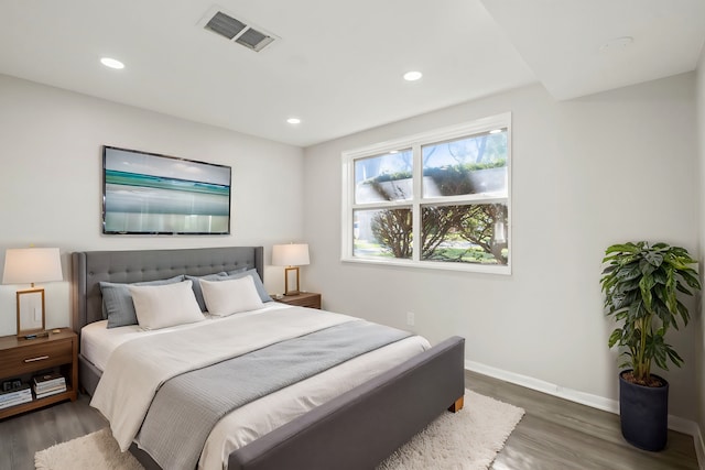 bedroom featuring dark wood-type flooring