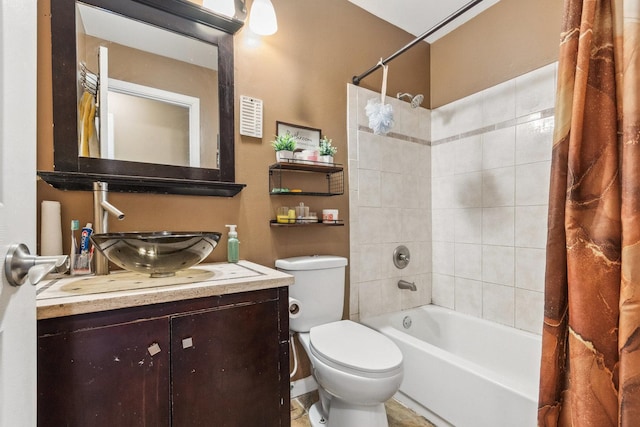 full bathroom featuring vanity, shower / bath combination with curtain, and toilet