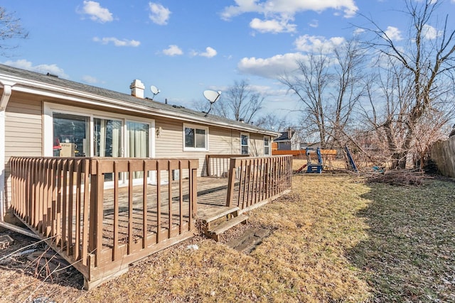 view of yard with a playground and a wooden deck