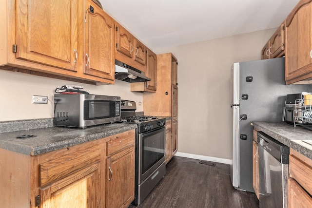 kitchen with dark hardwood / wood-style flooring and stainless steel appliances