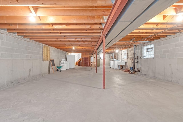 6102 W 64th St, Chicago, IL 60638 - basement featuring washer and clothes dryer, stairway, and a sink