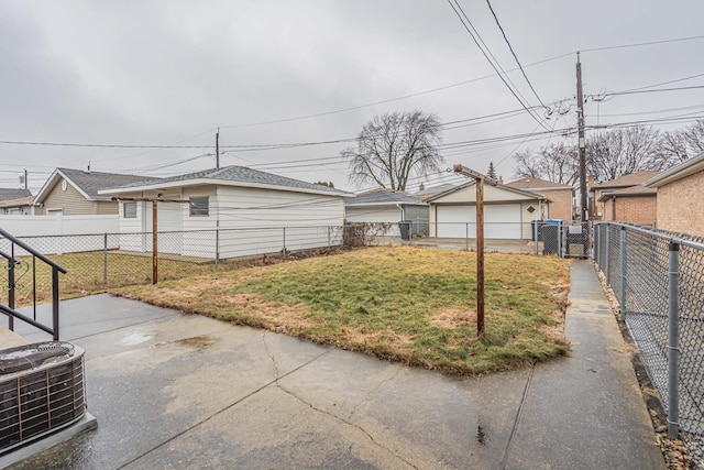 6102 W 64th St, Chicago, IL 60638 - view of yard with a garage, a patio, a fenced backyard, an outdoor structure, and central AC