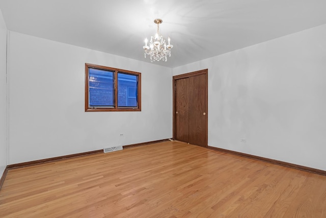 6102 W 64th St, Chicago, IL 60638 - empty room featuring light wood-style flooring, visible vents, and baseboards