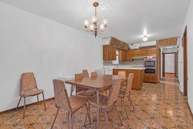6102 W 64th St, Chicago, IL 60638 - dining room featuring baseboards and a chandelier