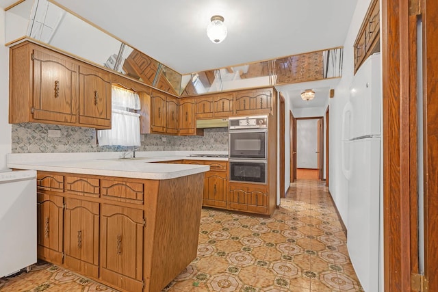 6102 W 64th St, Chicago, IL 60638 - kitchen with brown cabinets, light countertops, backsplash, white appliances, and a peninsula