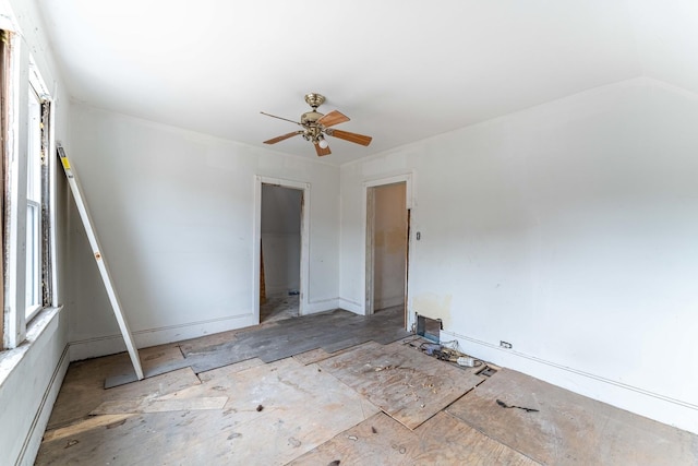 unfurnished room with ceiling fan