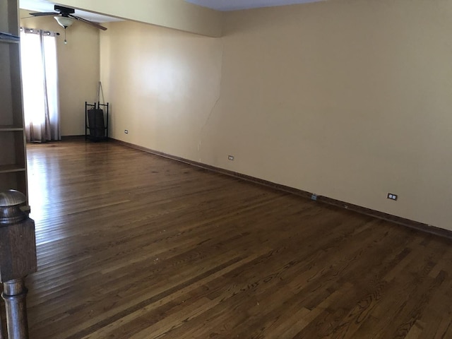 unfurnished living room with ceiling fan and dark hardwood / wood-style flooring