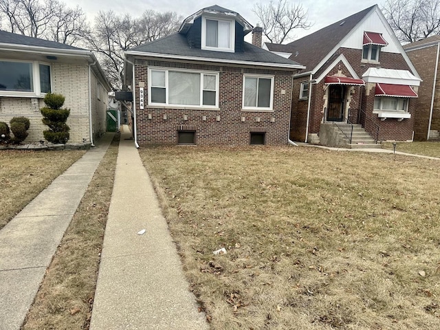 bungalow with a front yard