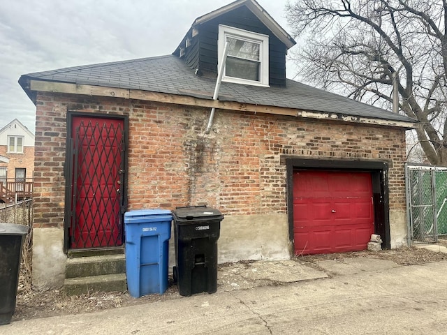 view of side of property with a garage