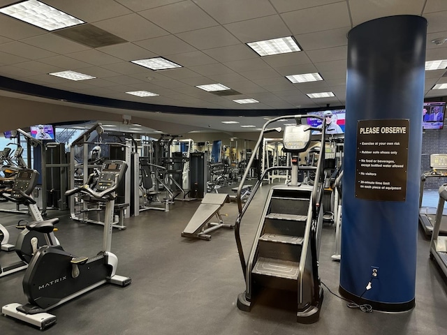 workout area with a paneled ceiling