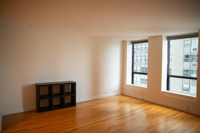 spare room with light hardwood / wood-style flooring