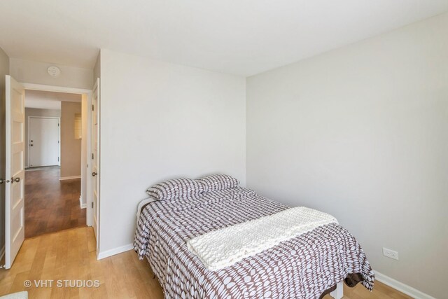 bedroom featuring hardwood / wood-style floors