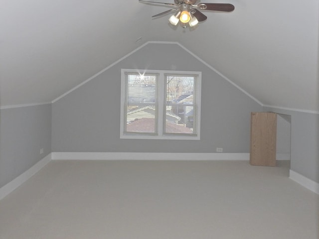 bonus room featuring ceiling fan, carpet flooring, and vaulted ceiling