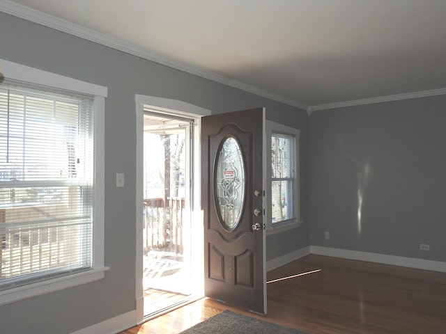 entryway with hardwood / wood-style flooring and ornamental molding