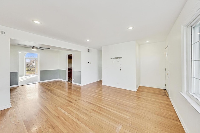 spare room featuring ceiling fan and light hardwood / wood-style floors