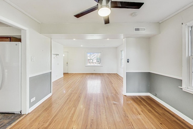 spare room with ceiling fan and light hardwood / wood-style floors