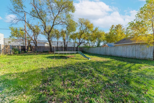 view of yard with a trampoline