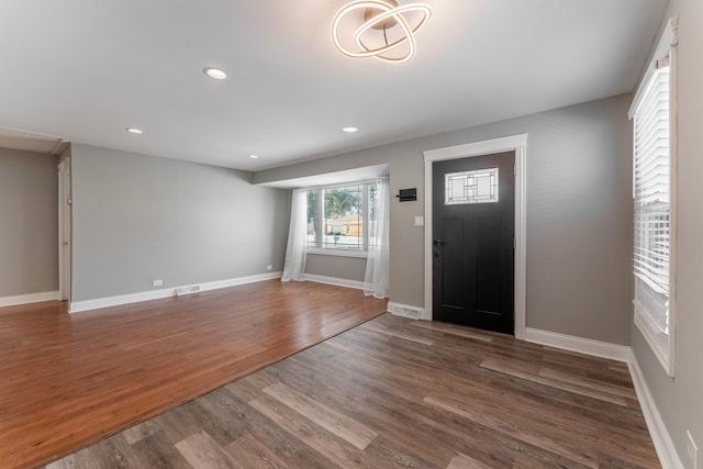 foyer with dark hardwood / wood-style flooring