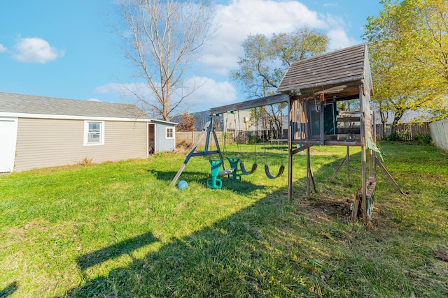 view of yard with an outdoor structure and a playground