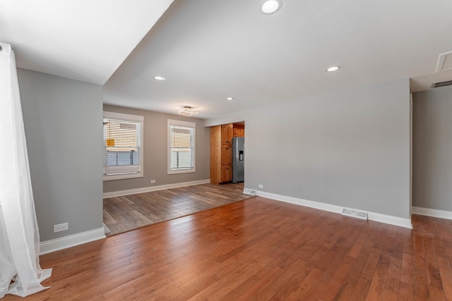 unfurnished living room featuring light wood-type flooring