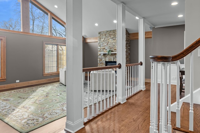 corridor featuring hardwood / wood-style floors and a high ceiling