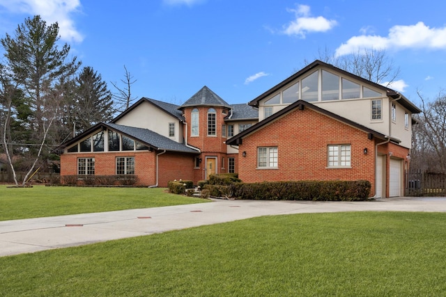 view of front property with a garage and a front lawn