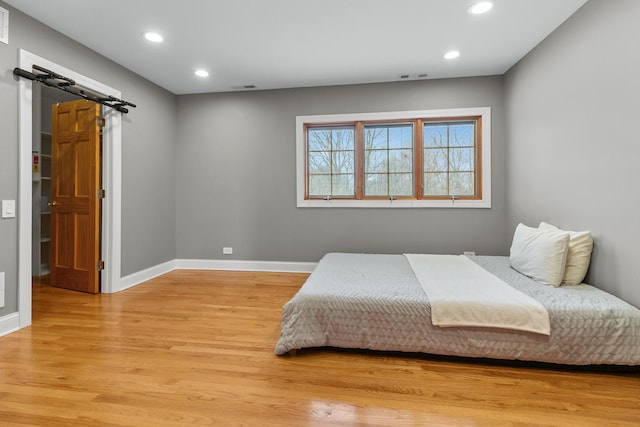 bedroom with light wood-type flooring