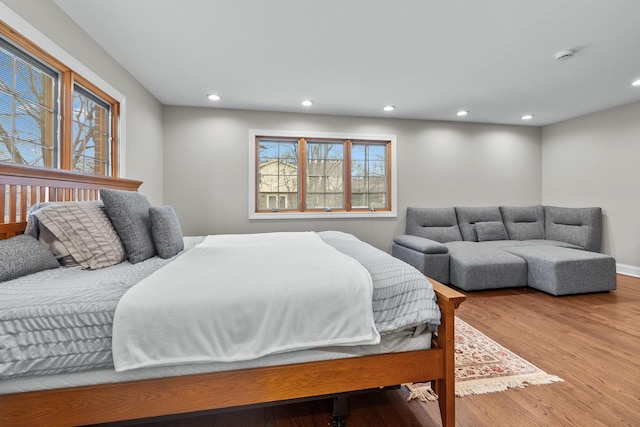 bedroom with hardwood / wood-style floors