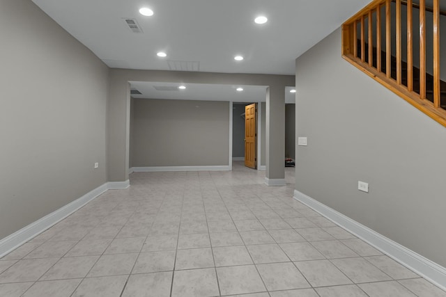 spare room featuring light tile patterned floors