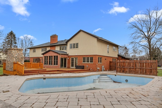 view of swimming pool featuring a deck