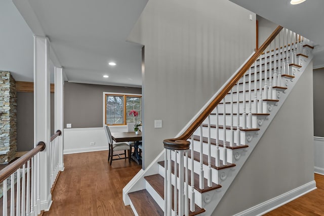 stairs with hardwood / wood-style flooring