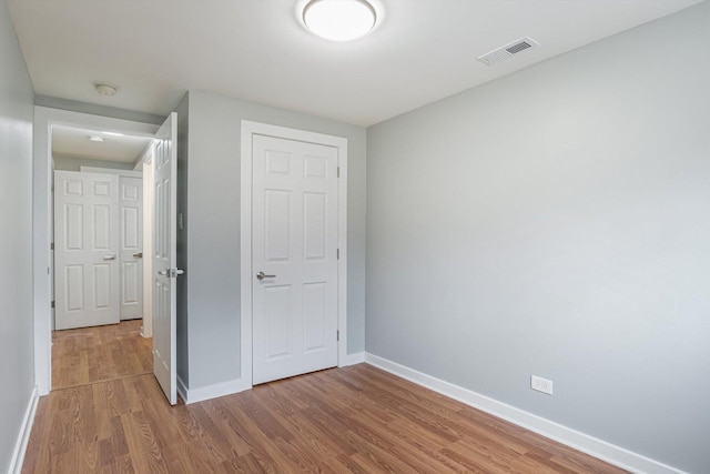 unfurnished bedroom featuring wood-type flooring